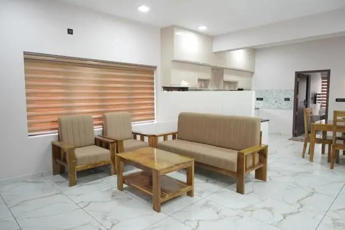 Living area of the One Bedroom Apartment with a sofa set and coffee table